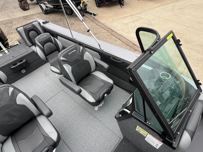 Slide: The Image of 2025 Lund 1975 Tyee boat interior with modern seating and windshield. - 25