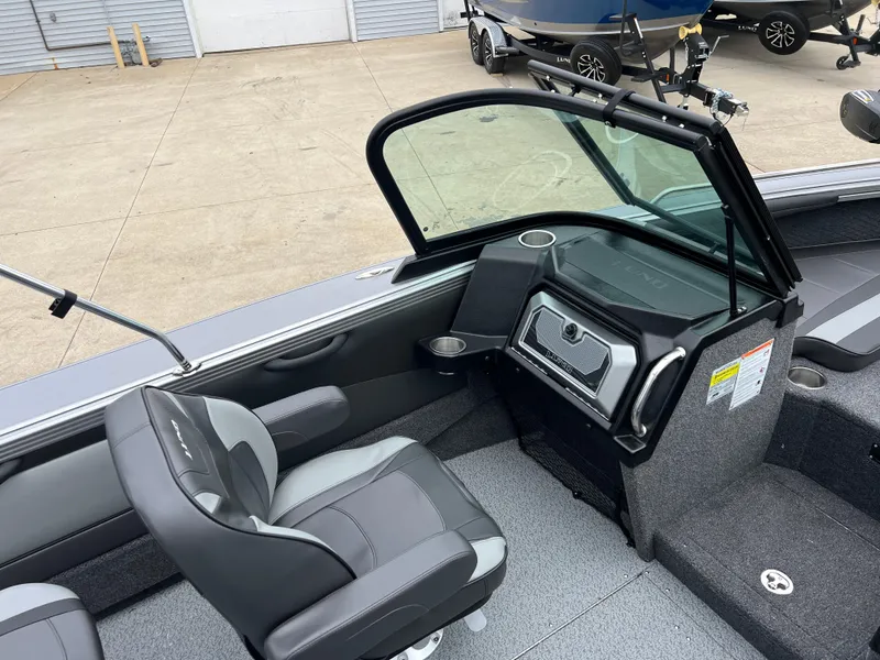 Slide: The Image of Interior of 2025 Lund 1975 Tyee boat with gray seating and dashboard. - 26