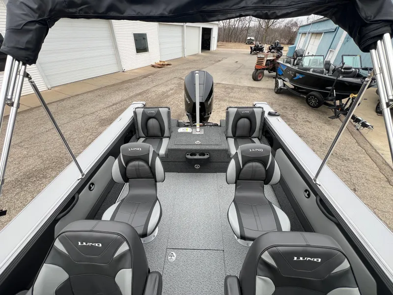 Slide: The Image of 2025 Lund 1975 Tyee boat interior with gray seating and modern design. - 31