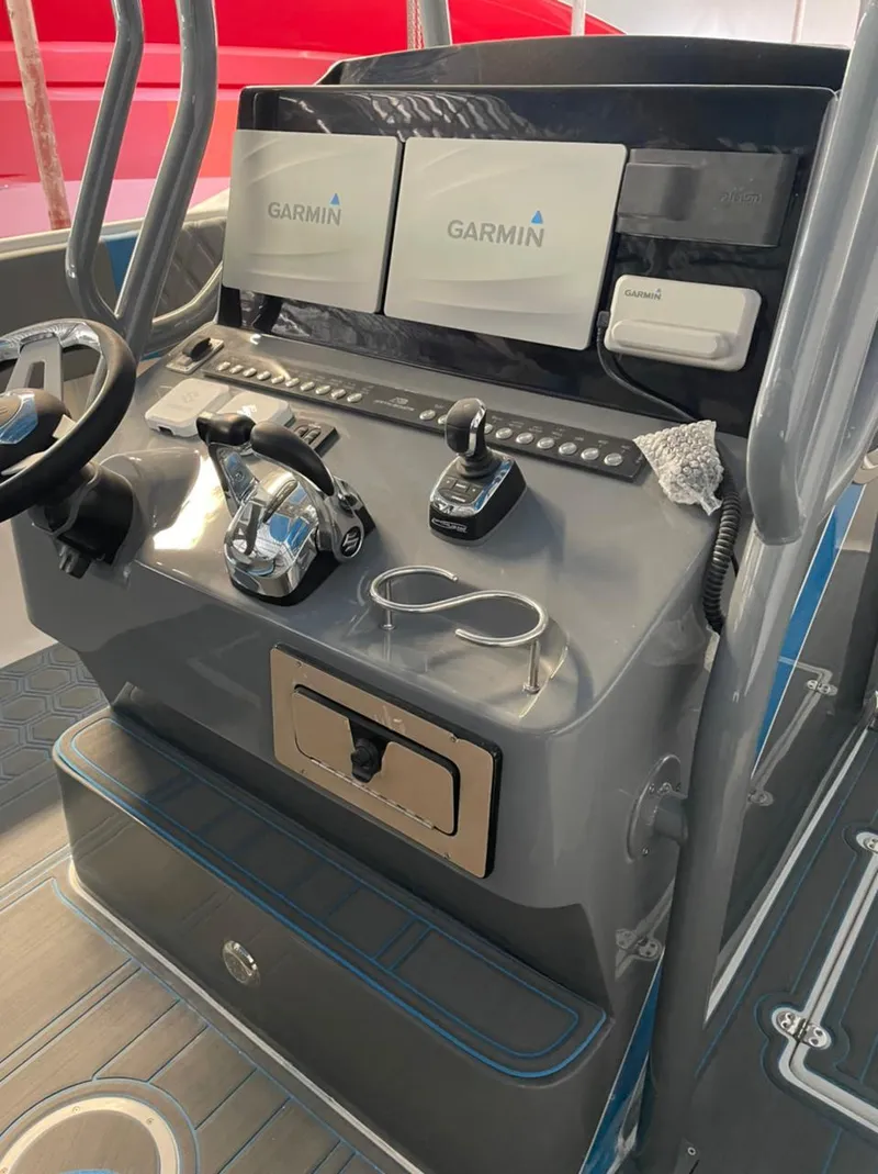 Slide: The Image of Boat control panel with Garmin displays, AMP 333 model, 2021. - 19