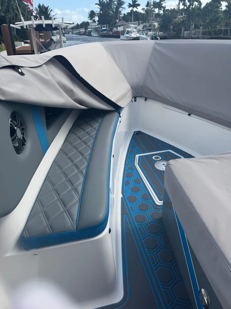 Slide: The Image of Luxury AMP 333 boat interior, 2021 model, featuring sleek seating and modern design. - 28