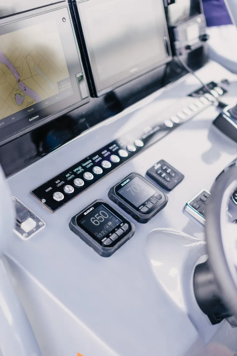 Slide: The Image of Boat control panel with digital displays and navigation screens, AMP 333 model, 2021. - 7