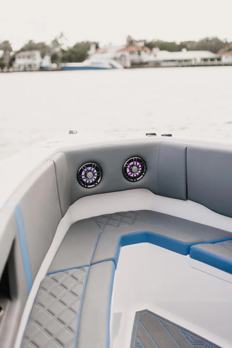 Slide: The Image of Interior of 2021 AMP 333 boat with modern seating and speakers. - 8
