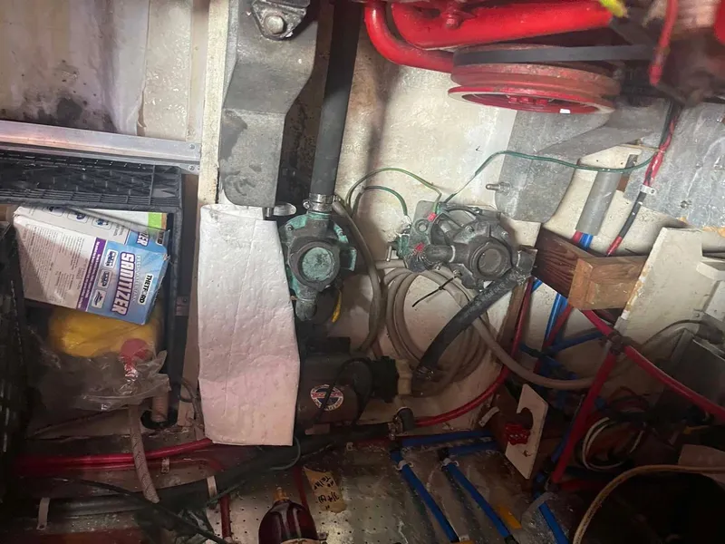 Slide: The Image of Engine room of 1987 Hartman-Palmer 38 with mechanical components and wiring. - 49