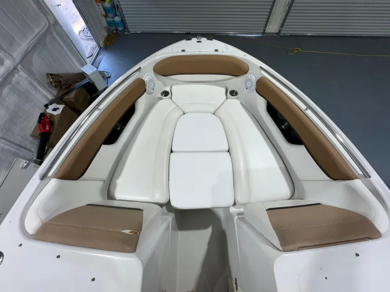 Slide: The Image of 2012 Four Winns H260 boat interior with tan and white seating. - 10