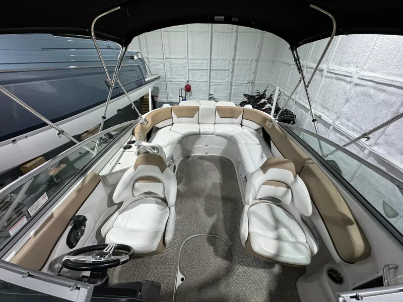 Slide: The Image of Interior view of 2012 Four Winns H260 boat with spacious seating and modern design. - 11