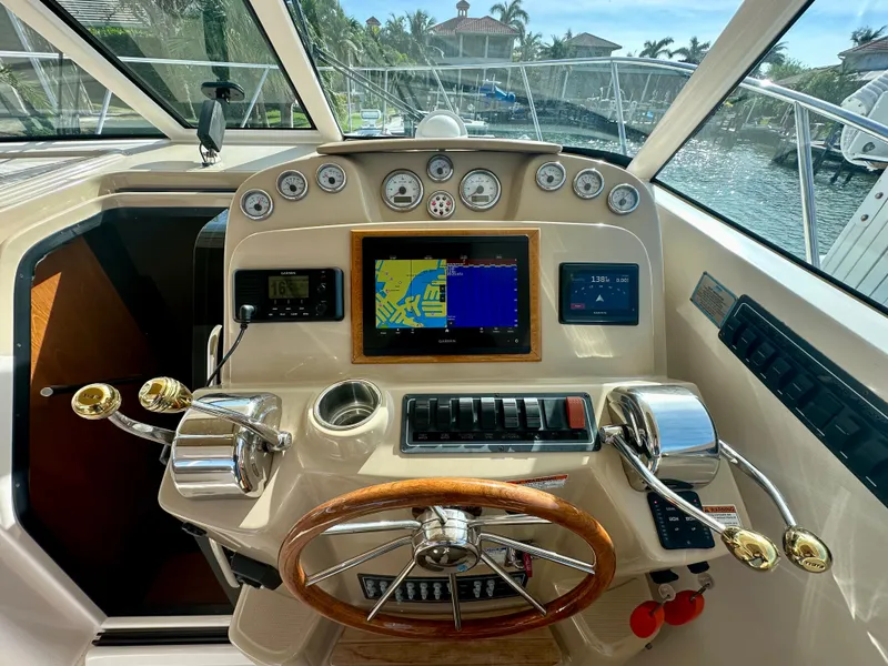 Slide: The Image of 2012 Tiara Yachts 3100 Coronet helm with navigation system and controls. - 16