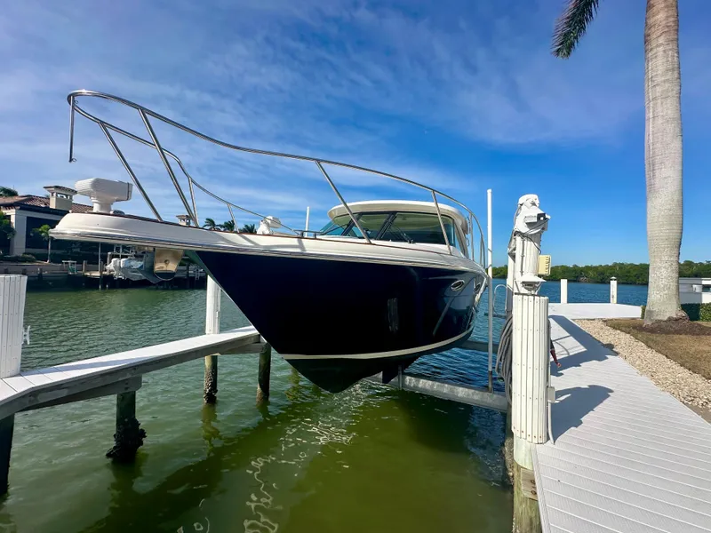 Slide: The Image of 2012 Tiara Yachts 3100 Coronet docked on a sunny day. - 2