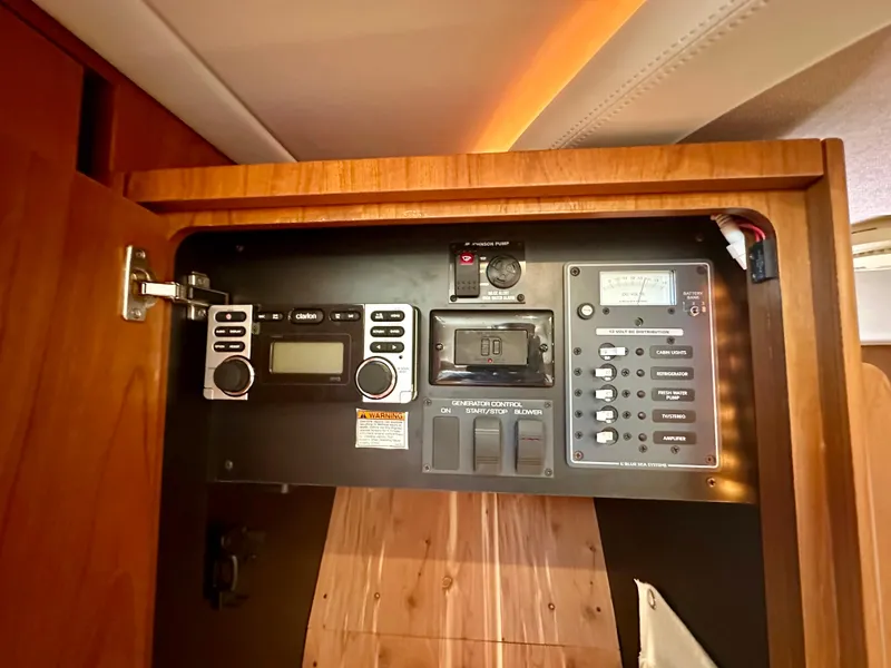 Slide: The Image of Control panel inside 2012 Tiara Yachts 3100 Coronet, featuring various electronic systems. - 25