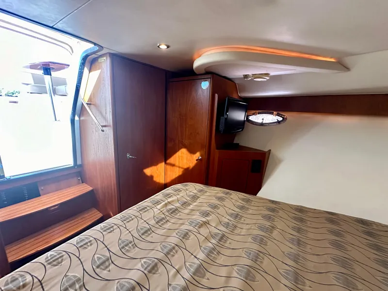 Slide: The Image of Luxurious cabin interior of 2012 Tiara Yachts 3100 Coronet with elegant wood finishes. - 26
