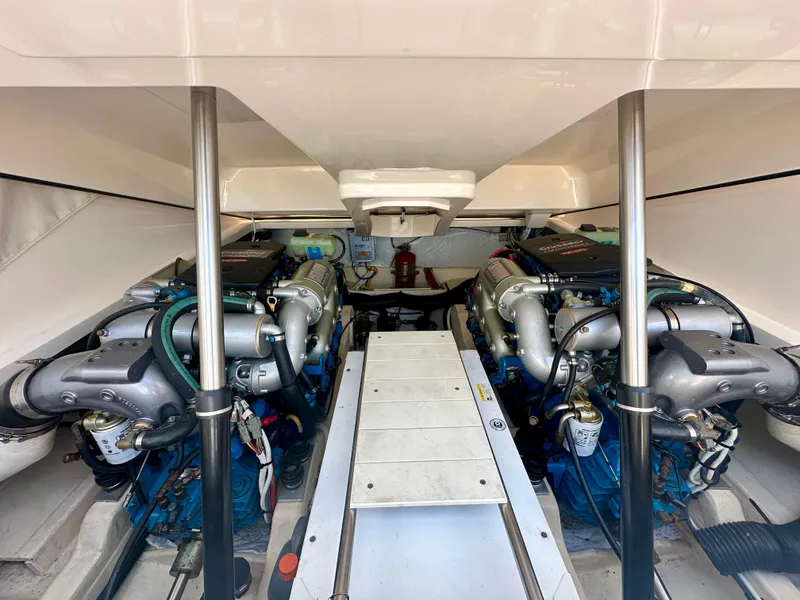 Slide: The Image of Engine compartment of 2012 Tiara Yachts 3100 Coronet, showcasing dual engines and mechanical components. - 31