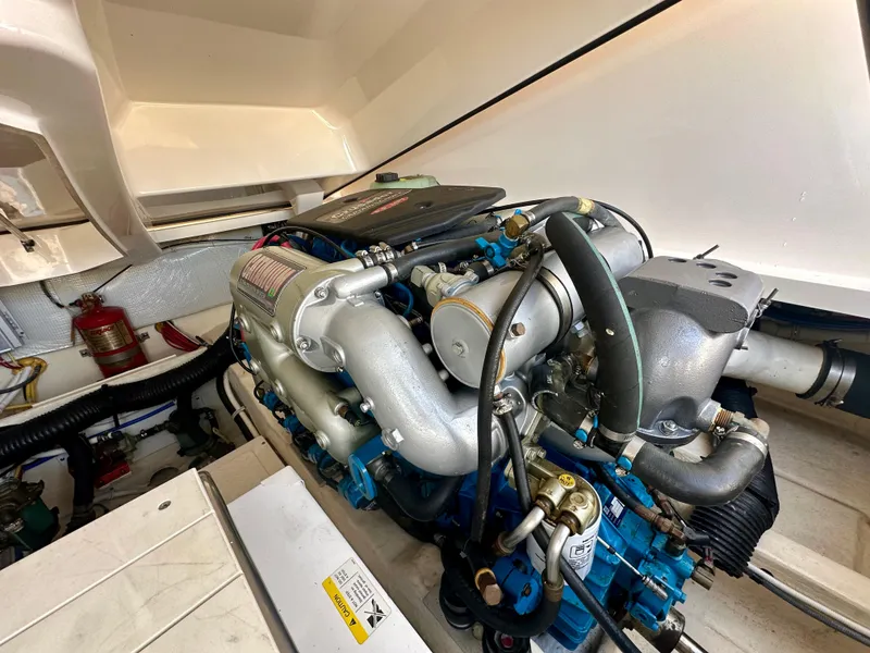 Slide: The Image of Engine compartment of 2012 Tiara Yachts 3100 Coronet, showcasing detailed mechanical components. - 33