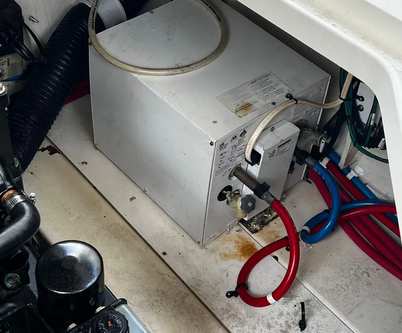 Slide: The Image of Engine compartment of 2006 Sea Ray 260 Sundancer with wiring and components. - 10