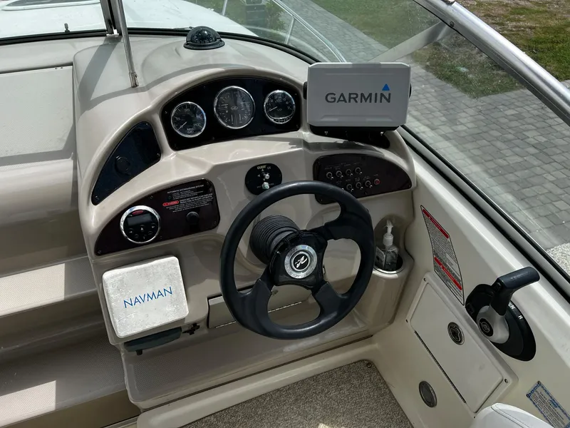 Slide: The Image of 2006 Sea Ray 260 Sundancer helm with Garmin and Navman navigation systems. - 5