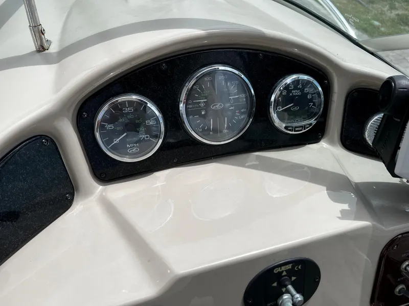 Slide: The Image of Dashboard of 2006 Sea Ray 260 Sundancer boat with gauges and controls. - 6