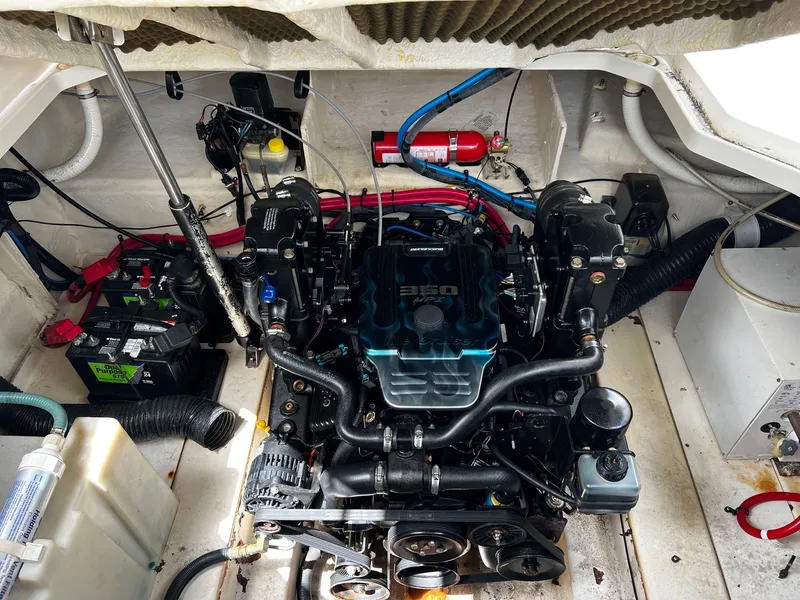 Slide: The Image of Engine compartment of 2006 Sea Ray 260 Sundancer with visible components and wiring. - 7