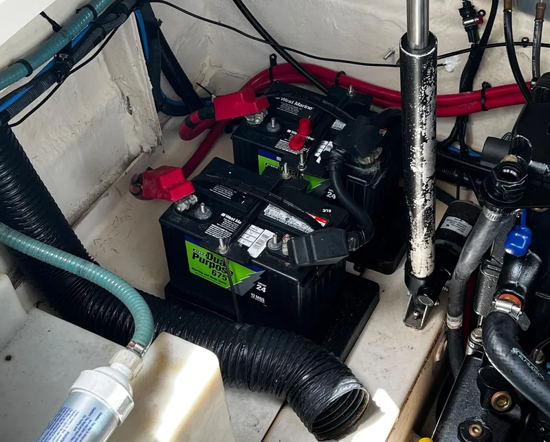 Slide: The Image of Battery compartment of 2006 Sea Ray 260 Sundancer with wiring and components. - 9