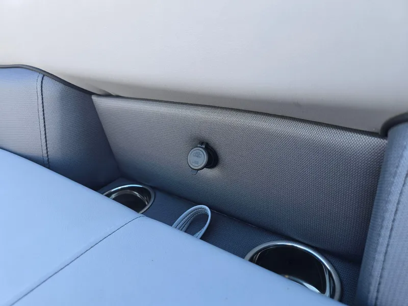 Slide: The Image of 2025 Bentley Pontoons 223 Quad Swingback Legacy Tritoon interior with cup holders and USB port. - 16