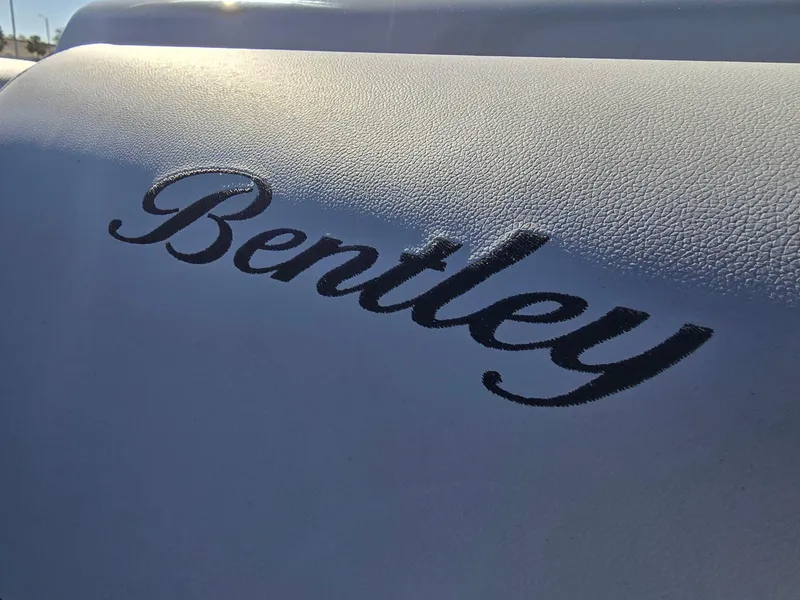 Slide: The Image of Close-up of Bentley logo on 2025 Bentley Pontoons 223 Quad Swingback Legacy Tritoon. - 17