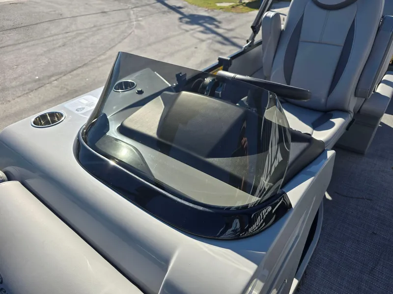 Slide: The Image of 2025 Bentley Pontoons 223 Quad Swingback Legacy Tritoon dashboard and seating detail. - 18