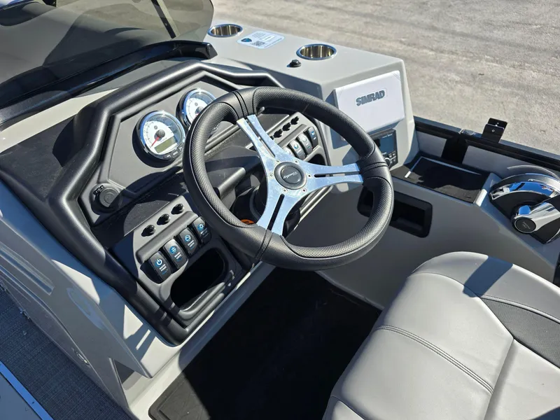 Slide: The Image of 2025 Bentley Pontoons 223 Quad Swingback Legacy Tritoon dashboard and steering wheel. - 6