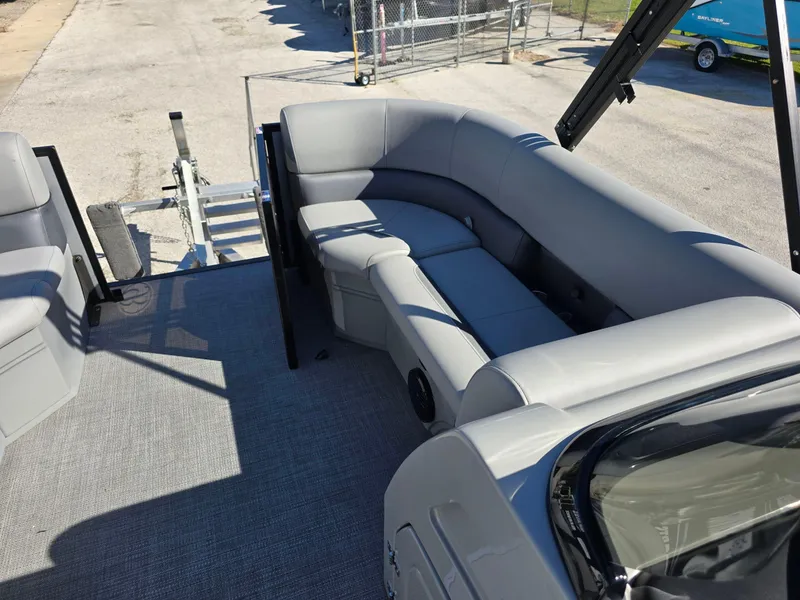 Slide: The Image of 2025 Bentley Pontoons 223 Quad Swingback Legacy Tritoon interior with gray seating and open deck. - 7