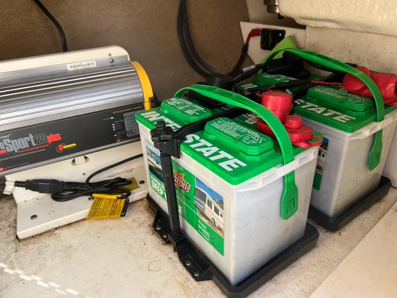 Slide: The Image of Boat battery setup in 2017 Chaparral H20 with Interstate batteries and Sportz Plus charger. - 12
