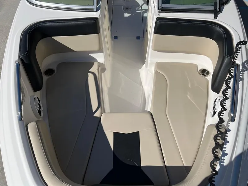 Slide: The Image of 2017 Chaparral H20 boat interior with beige and black seating. - 14