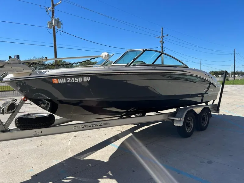 Slide: The Image of 2017 Chaparral H20 boat on trailer under clear blue sky. - 4