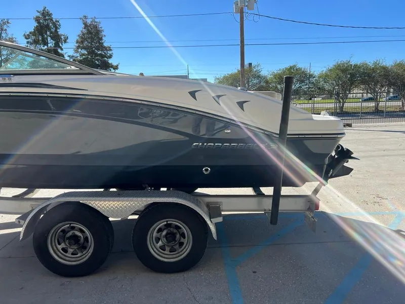 Slide: The Image of 2017 Chaparral H20 boat on trailer under sunny sky. - 5