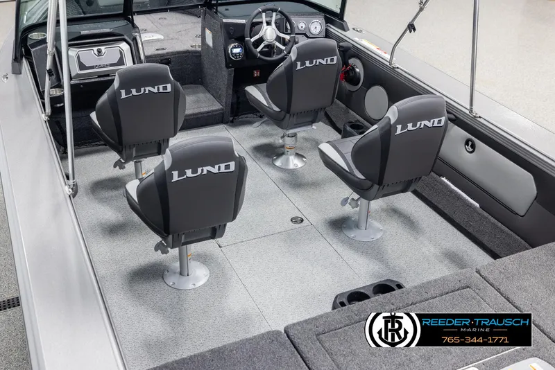 Slide: The Image of Interior of 2025 Lund 1975 Tyee boat with four swivel seats and steering console. - 10