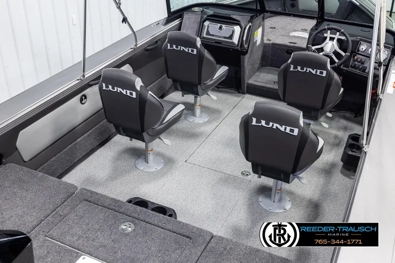 Slide: The Image of Interior of 2025 Lund 1975 Tyee boat with four swivel seats and modern dashboard. - 11