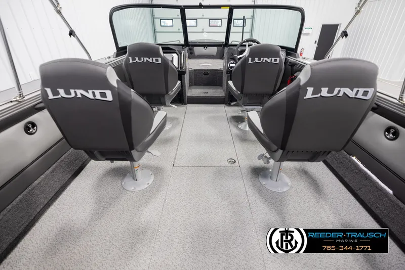 Slide: The Image of Interior of 2025 Lund 1975 Tyee boat with four seats and steering console. - 12