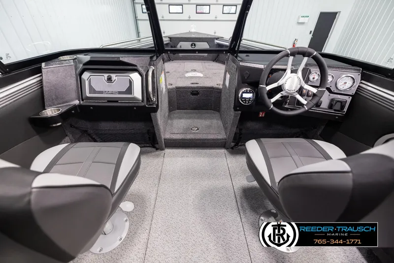 Slide: The Image of Interior of 2025 Lund 1975 Tyee boat with modern seating and steering console. - 13