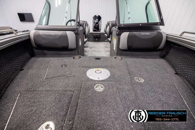 Slide: The Image of 2025 Lund 1975 Tyee boat interior with seating and storage compartments. - 15