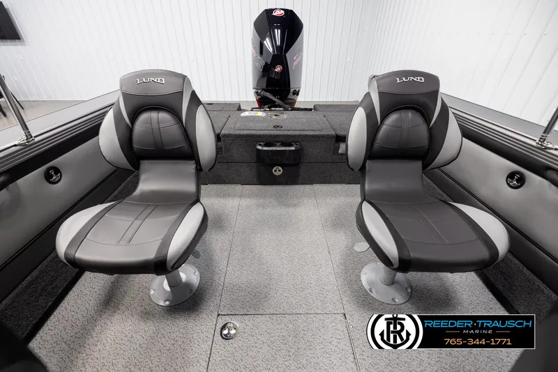 Slide: The Image of 2025 Lund 1975 Tyee boat interior with two swivel seats and motor. - 17