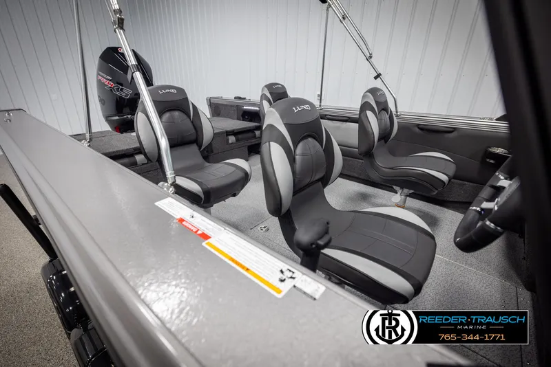 Slide: The Image of Interior of 2025 Lund 1975 Tyee boat with modern seating and motor. - 19