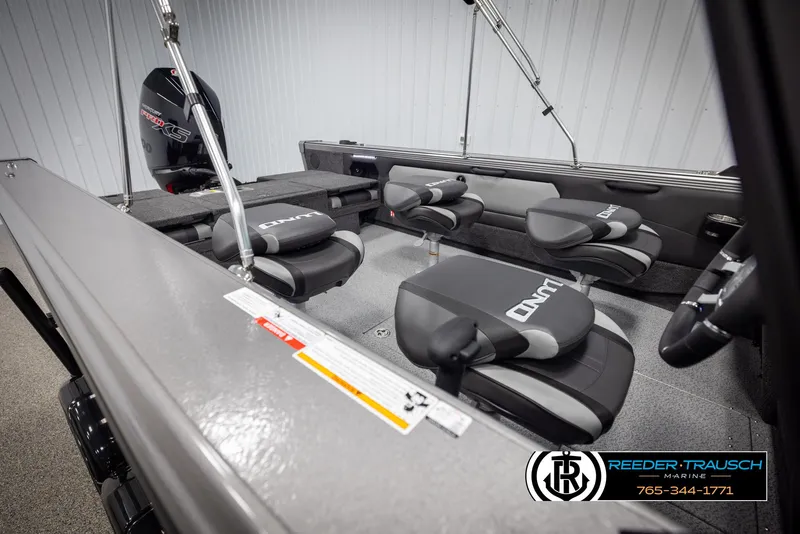 Slide: The Image of 2025 Lund 1975 Tyee boat interior with seating and motor, Reeder-Trausch Marine logo. - 20