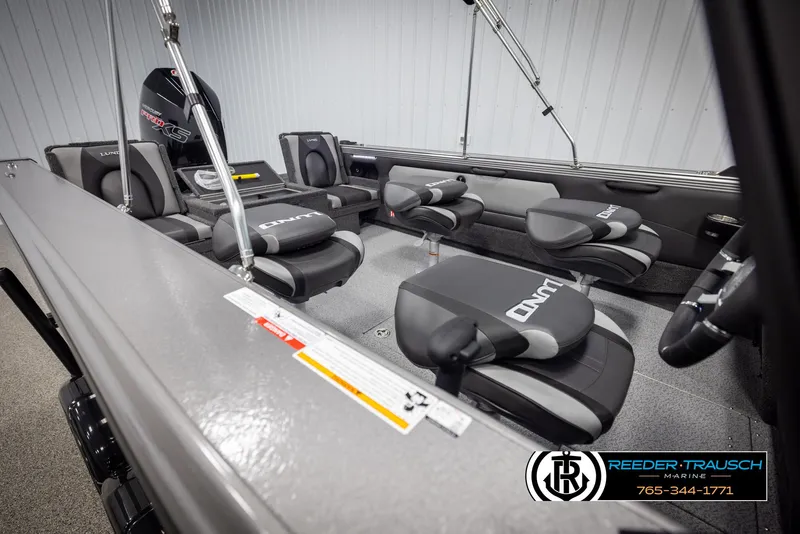 Slide: The Image of 2025 Lund 1975 Tyee boat interior with comfortable seating and modern design. - 21