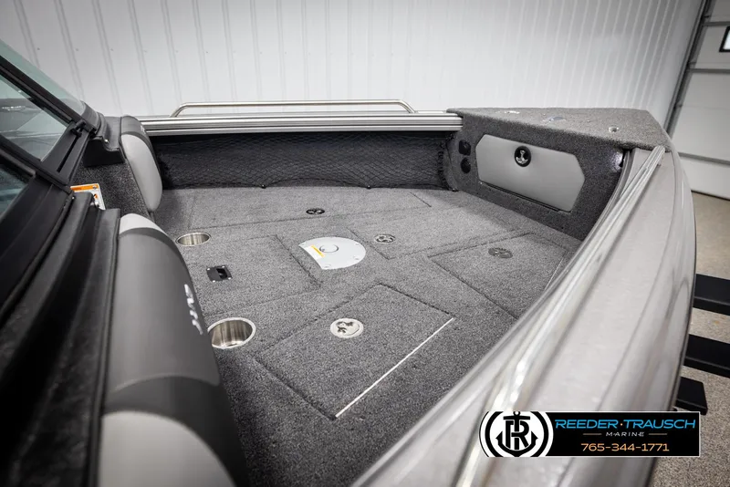 Slide: The Image of 2025 Lund 1975 Tyee boat interior with carpeted deck and storage compartments. - 22