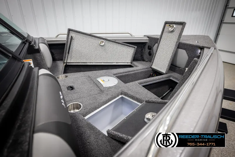 Slide: The Image of 2025 Lund 1975 Tyee boat interior with open storage compartments. - 23