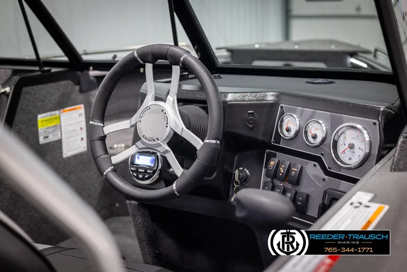 Slide: The Image of Interior of 2025 Lund 1975 Tyee boat with modern steering and dashboard controls. - 26