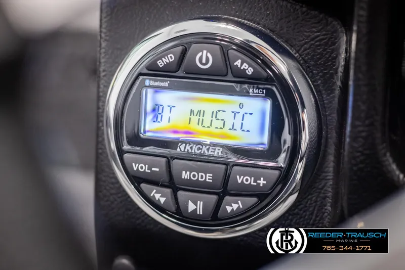 Slide: The Image of Close-up of Kicker audio system in 2025 Lund 1975 Tyee boat, displaying "BT Music". - 29