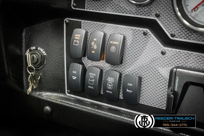 Slide: The Image of Dashboard of 2025 Lund 1975 Tyee with control switches and ignition key. - 31