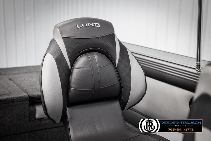Slide: The Image of Lund 1975 Tyee 2025 boat seat, black and gray design, Reeder-Trausch Marine logo. - 33