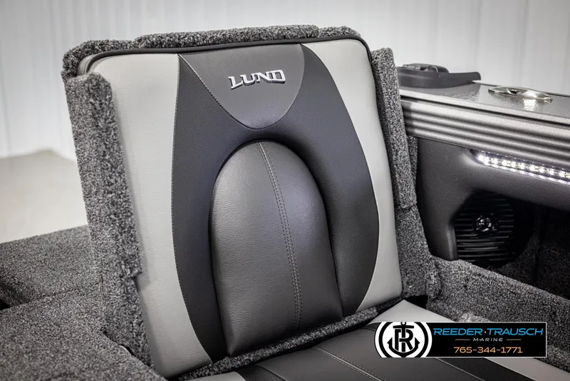 Slide: The Image of Lund 1975 Tyee 2025 boat seat with logo, featuring sleek black and gray design. - 34
