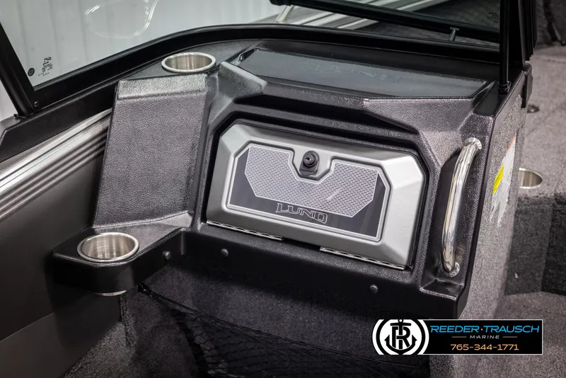 Slide: The Image of 2025 Lund 1975 Tyee boat interior with storage compartment and cup holders. - 35