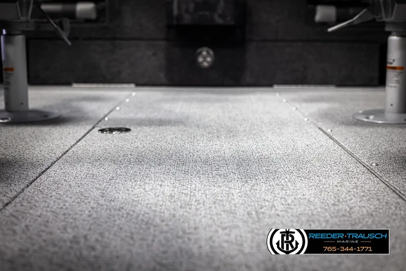 Slide: The Image of Interior of 2025 Lund 1975 Tyee boat with carpeted flooring and seating. - 41