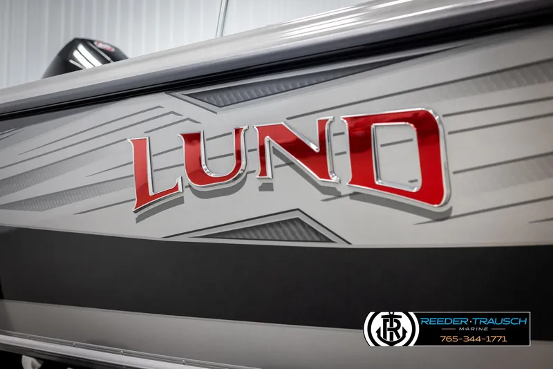 Slide: The Image of Lund 1975 Tyee 2025 boat with bold red logo and sleek design. - 49