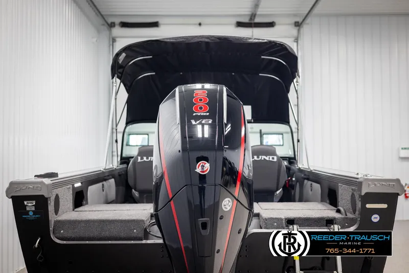 Slide: The Image of Lund 1975 Tyee 2025 boat with powerful V8 engine in a storage facility. - 6